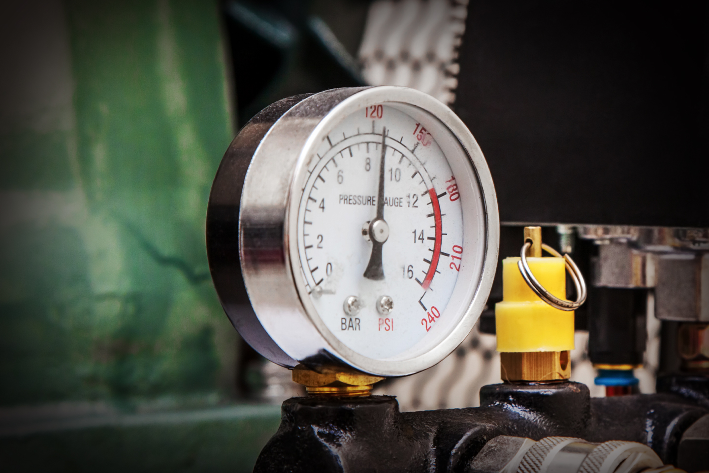 pressure gage attached to machinery 